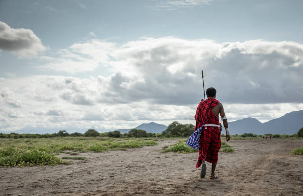 Maasai walking through Mkomazi dry savanna